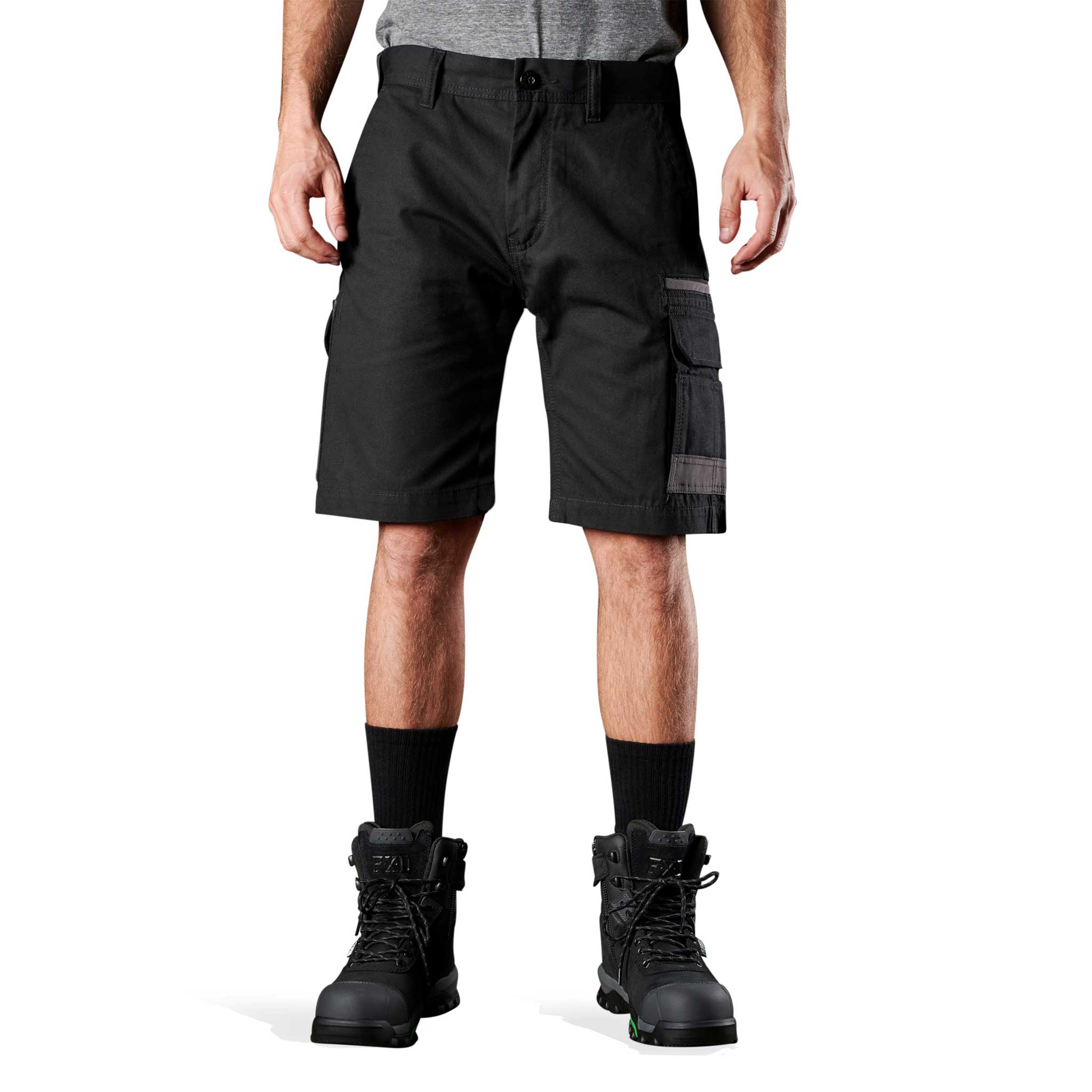 A man wearing FXD Cotton Canvas pockets work shorts in black