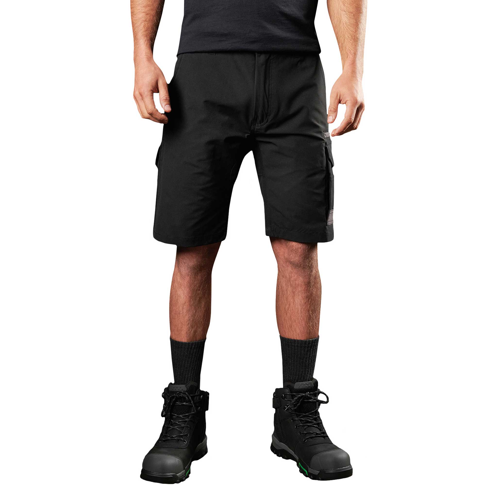A man wearing black FXD lightweight stretch work shorts