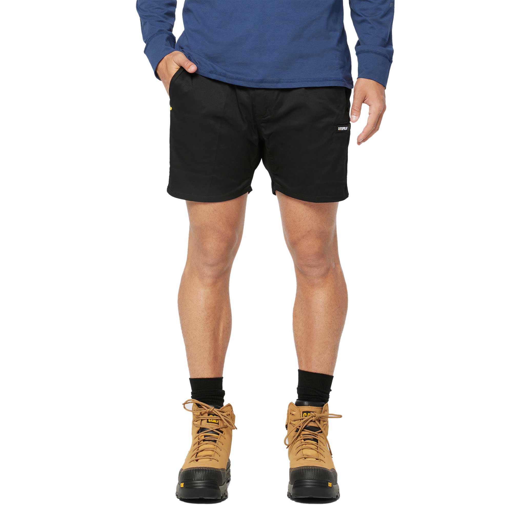 A man wearing CAT Haul pocket short in black
