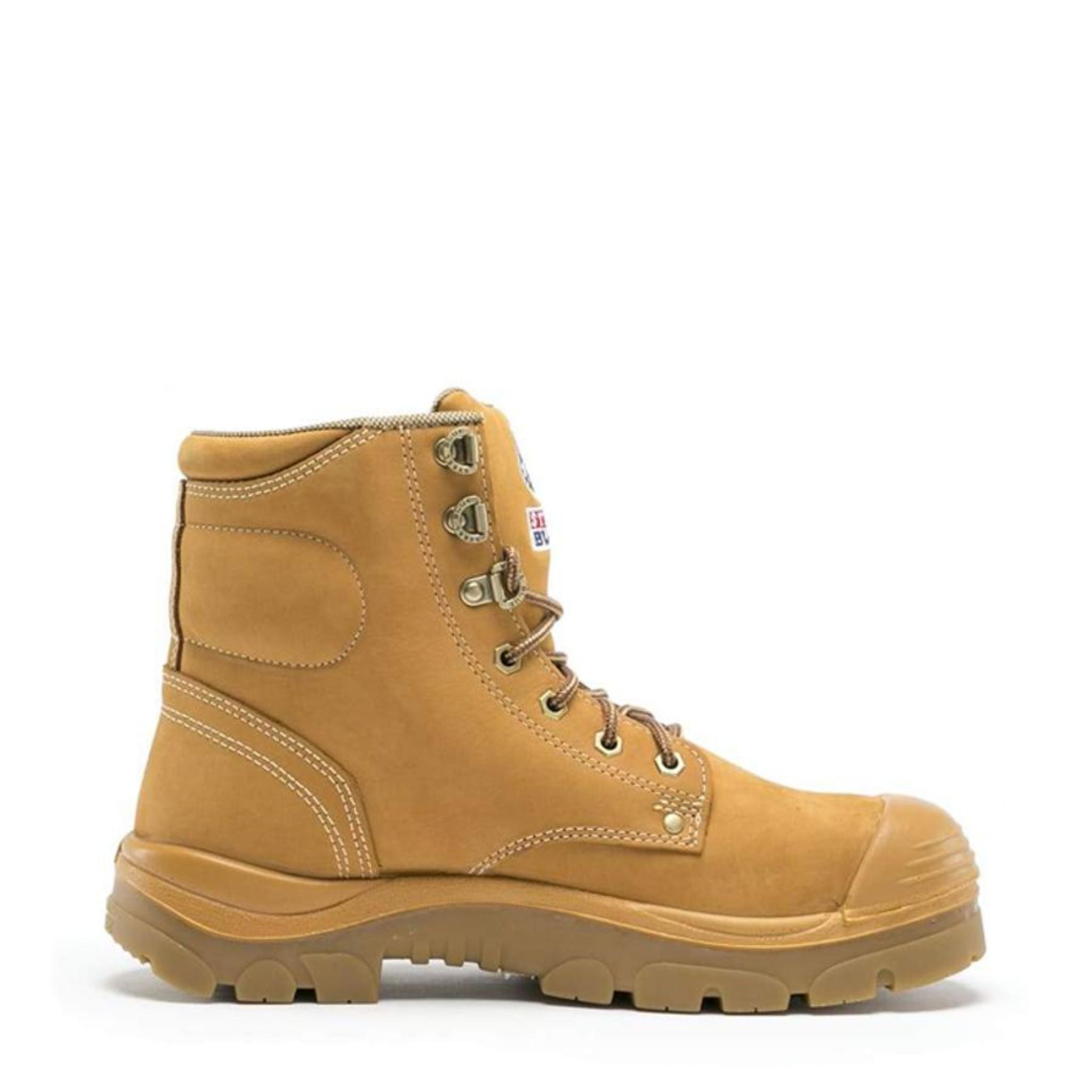 Sand-colored, ankle-high leather derby boot with brass eyelets and Steel Blue branding.