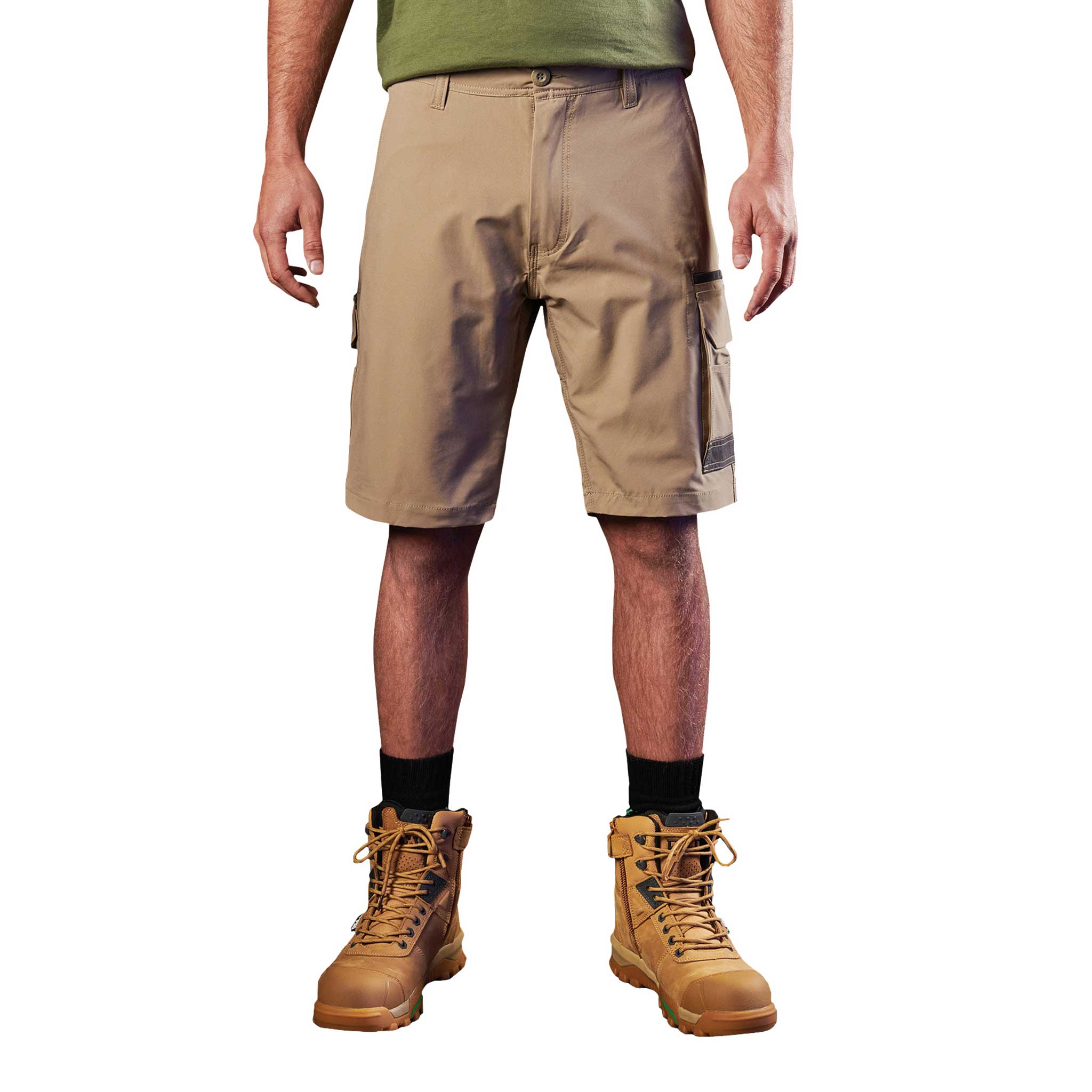 A man wearing khaki FXD lightweight stretch work shorts
