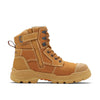 full height wheat leather work boot with sand coloured sole and toe cap with small blundstone logo. side zippered boot with keeper clasp that reads 9090

