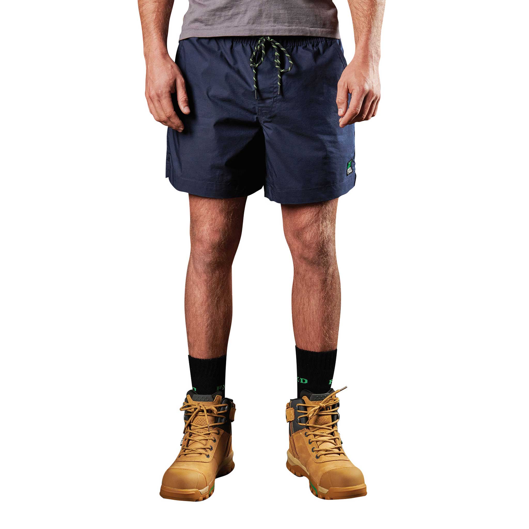 A man wearing FXD Elastic waist work shorts in navy